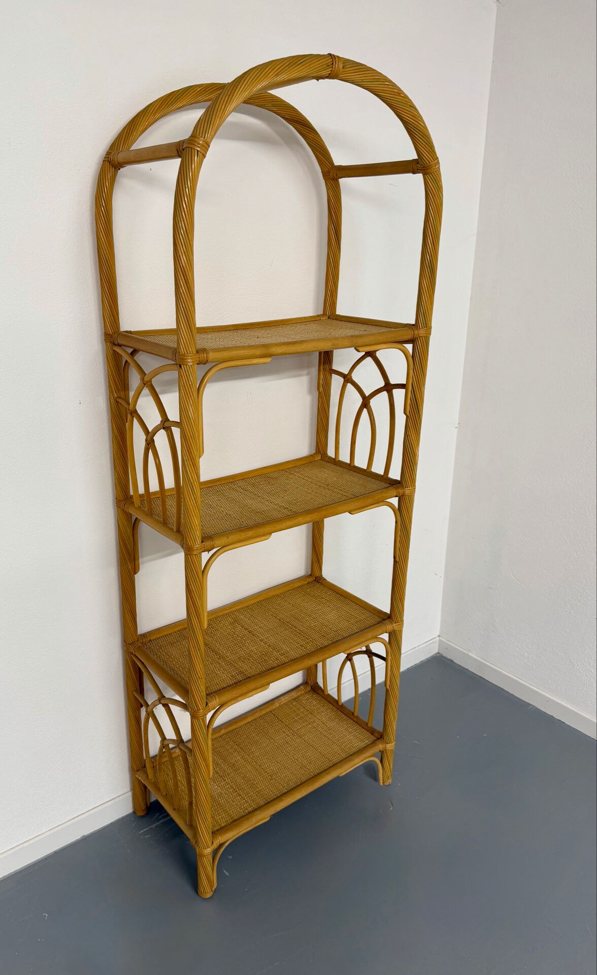 Large woven rattan bookshelf designed in the 1970s.