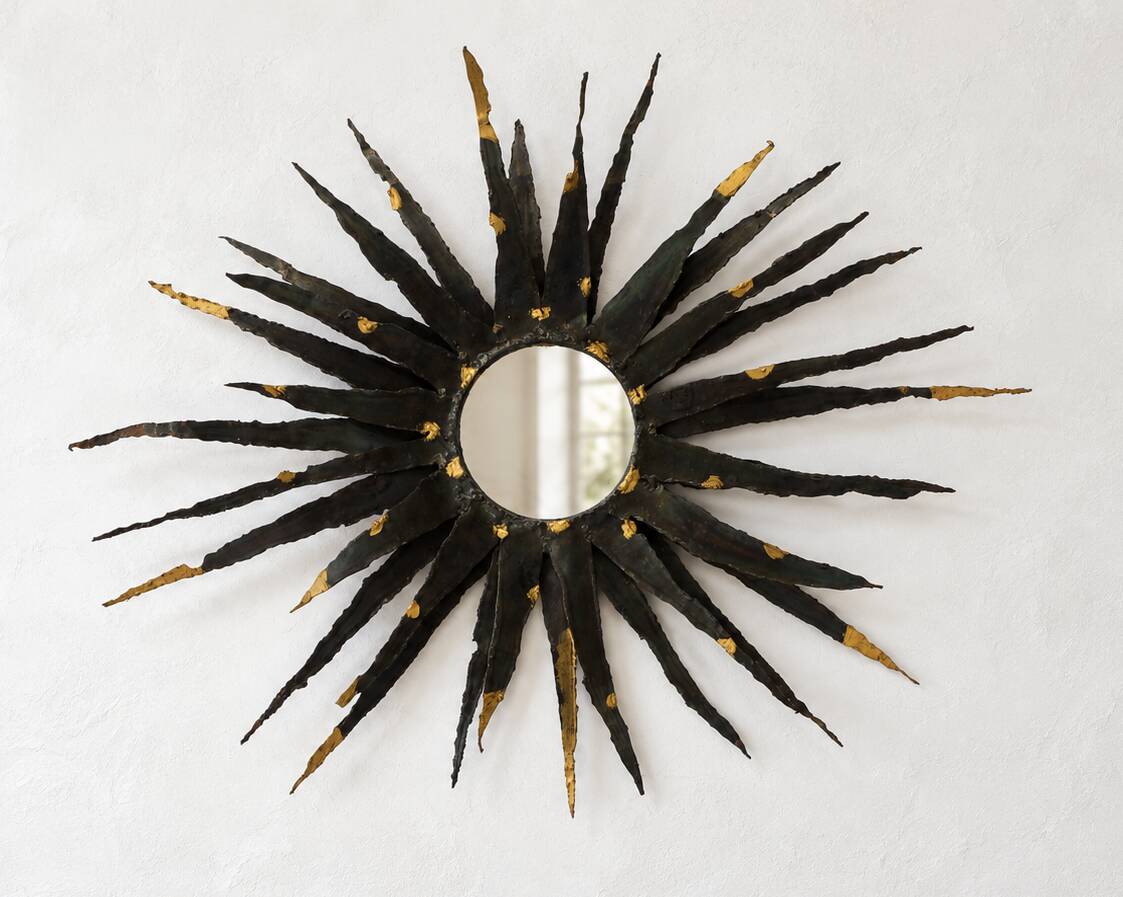 Large brutalist sun mirror in patinated metal with gold accents, 1970.
