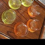 6 Glasses with the name Culbuto in 3 orange colors and 3 lemon yellow colors