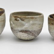 Trilogy of cups or Japanese-style goblets by the Danish ceramist Gutte Eriksen using RAKU technique.