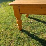 Solid oak coffee table with turned legs.