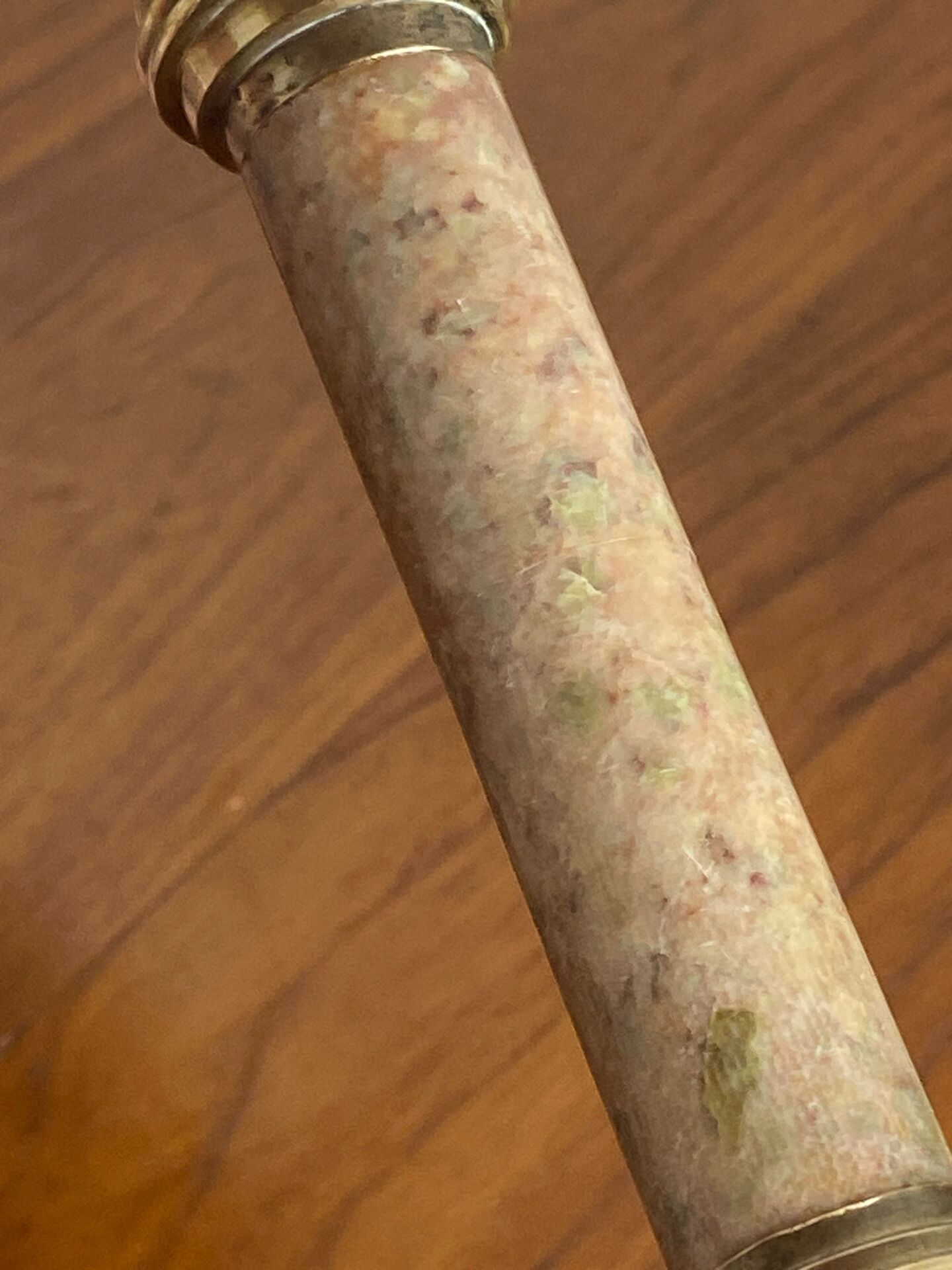 Pair of brass and stone candlesticks