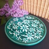 Dessous de plat vert à fleurs