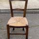 Solid wood chair in dark oak with rush seating, Louis Philippe style.