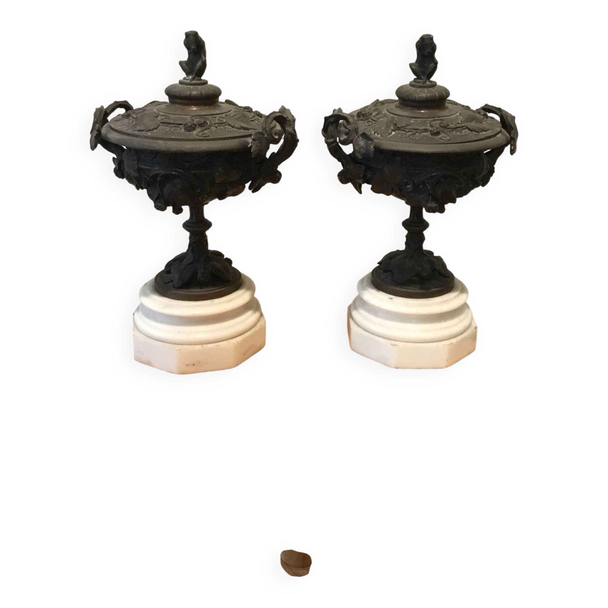 Bronze fireplace garnitures with marble base depicting leaves.