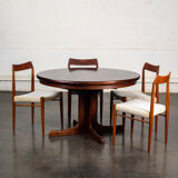 Table with central legs and 2 extensions.