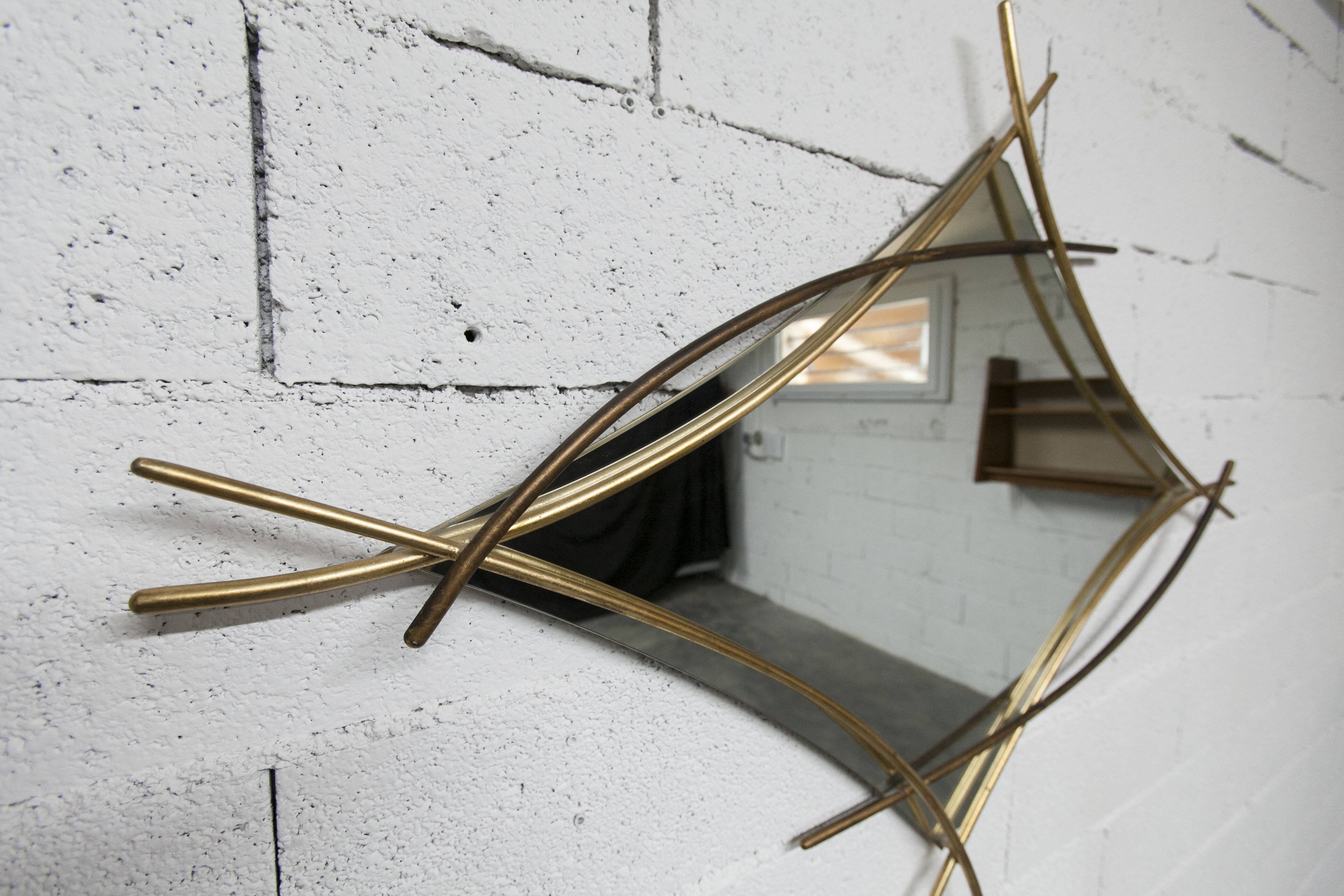 Sculptural mirror with two-tone gilded arches, France, 1970s, 95 x 133 cm