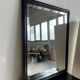 Rectangular mirror in molded blackened wood, beveled glass