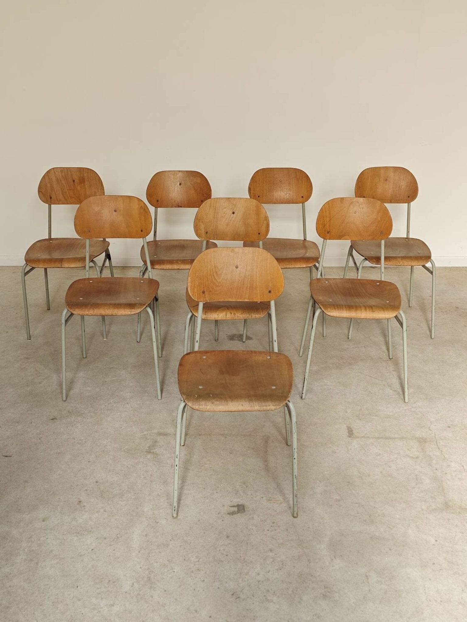 Set of 8 metal and wood school chairs  
Ex Czechoslovakia 1960