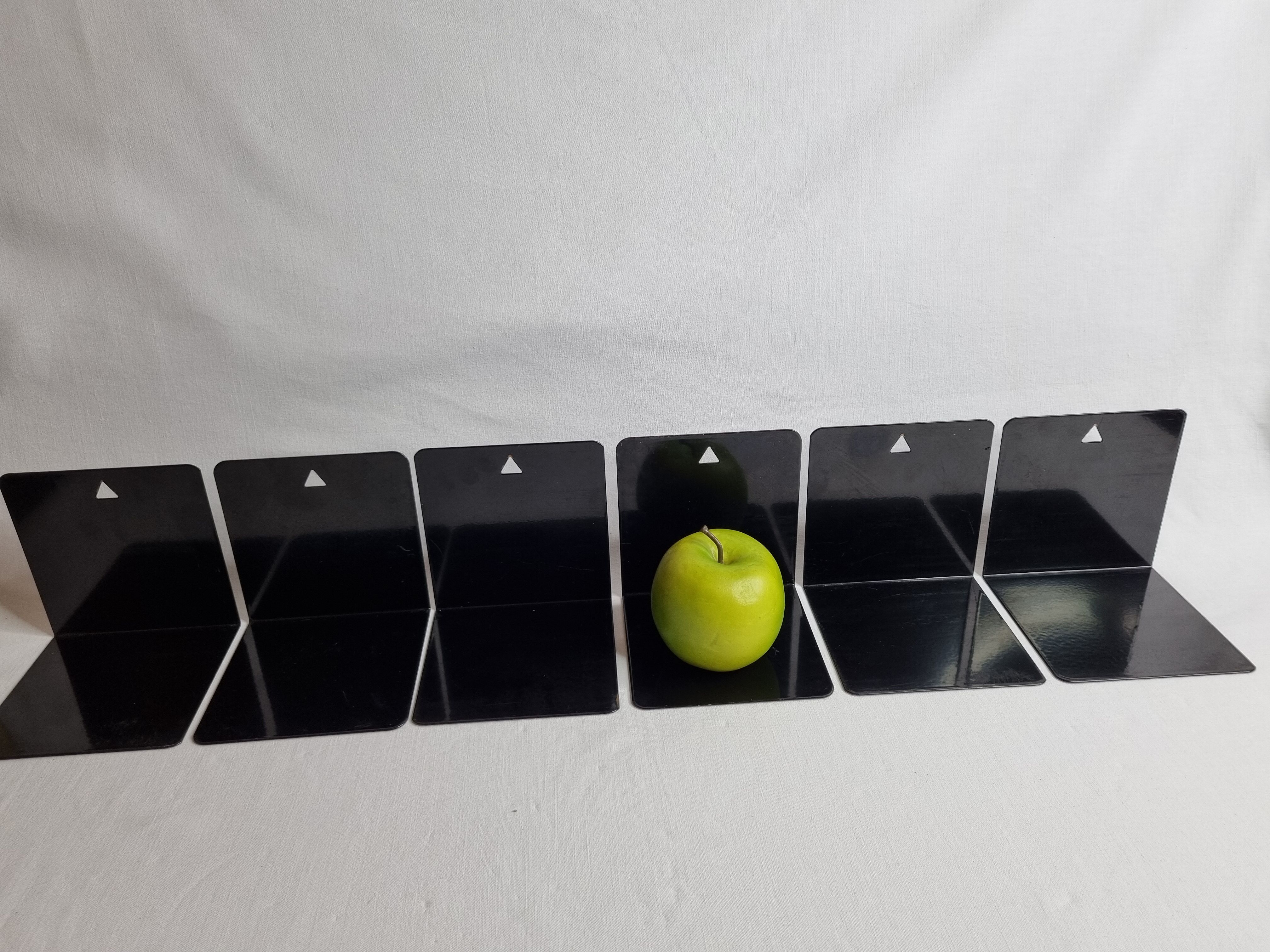 Set of six vintage black lacquered steel bookhouses