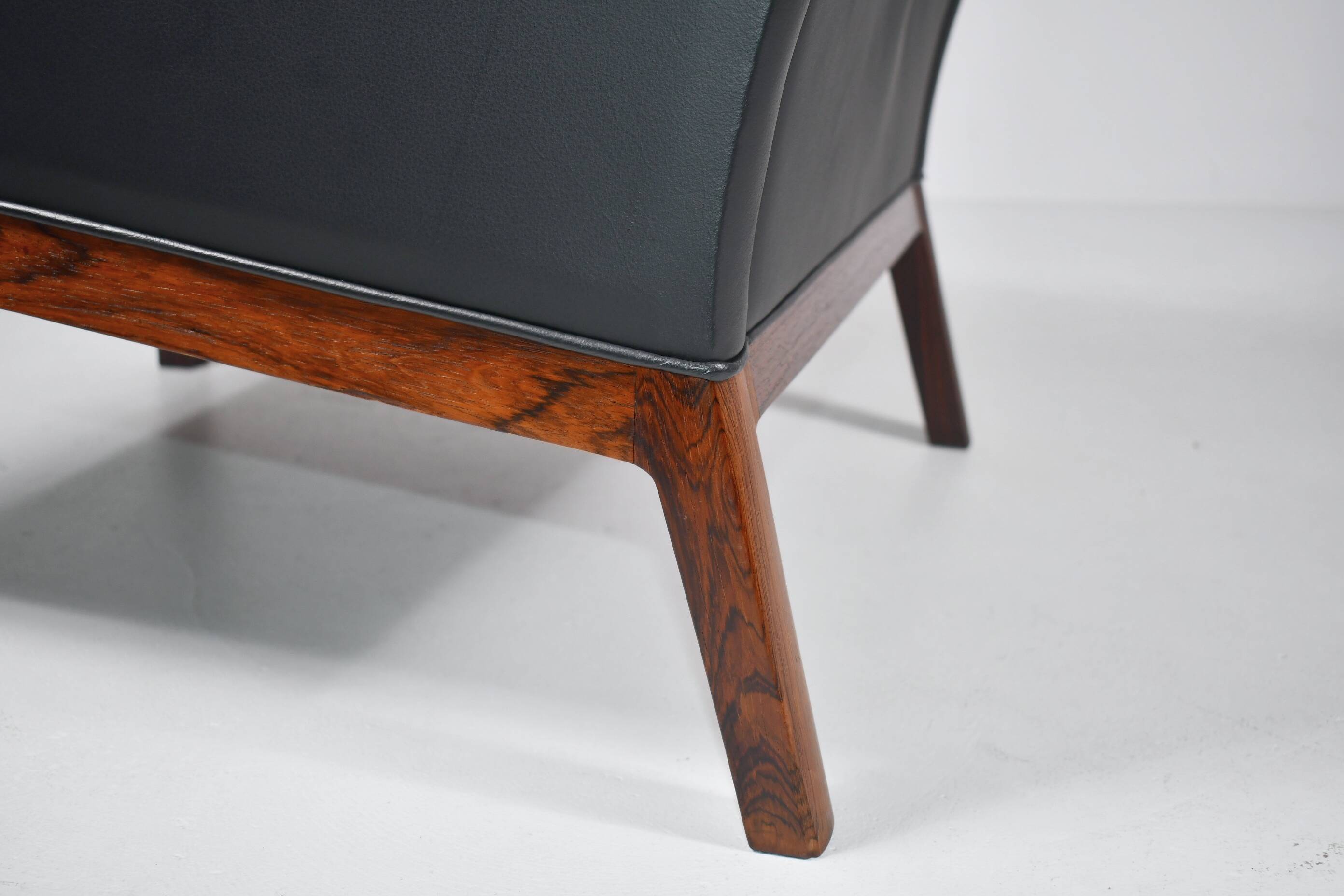 Leather and rosewood armchair by Kai lyngfeldt-Larsen. Denmark