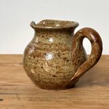 Small beige speckled stoneware pitcher