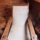 Vintage armchair in solid wood and geometric weaving – lodge spirit
