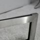 Coffee table with steel base and smoked glass slab. Circa 197