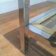 Table basse à double plateau en chrome et laiton