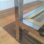 Table basse à double plateau en chrome et laiton