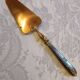Silver cake shovel filled with silver metal