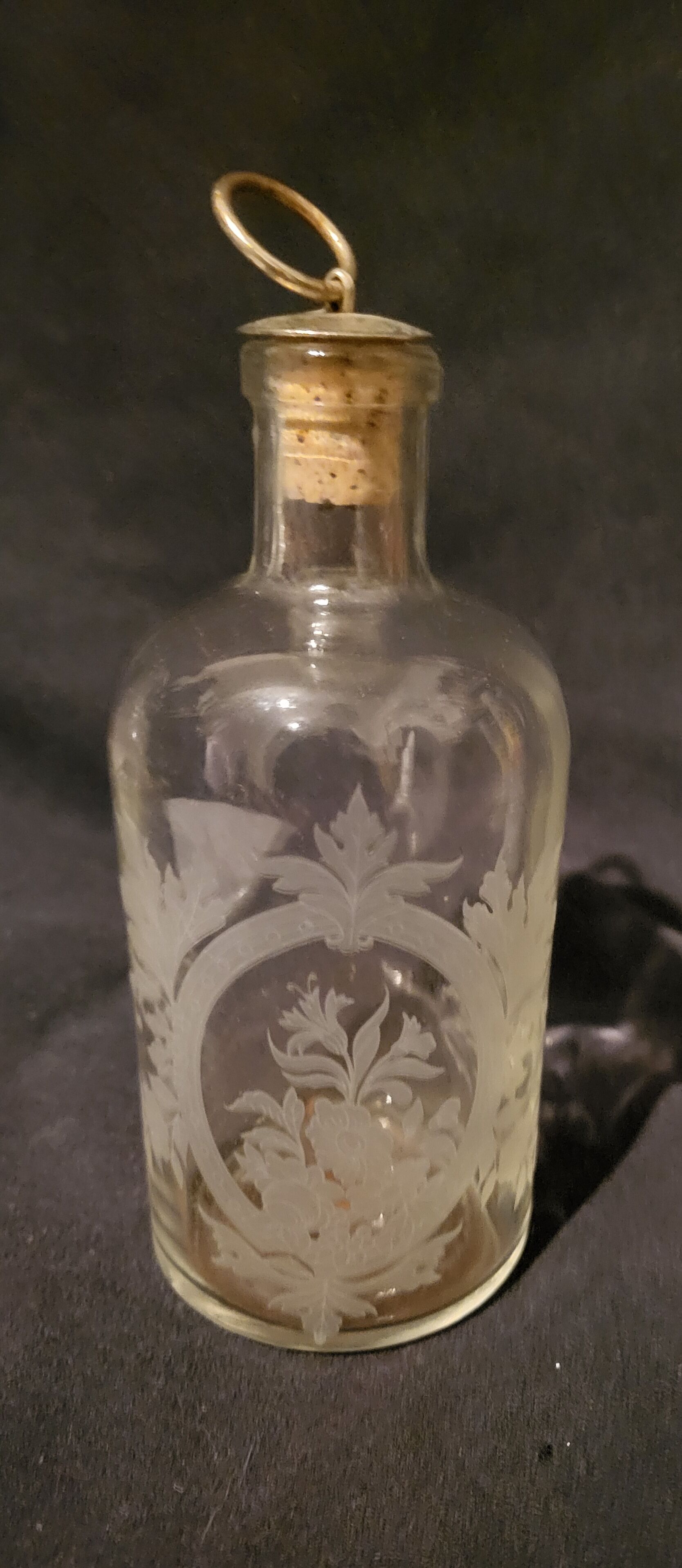 Engraved glass bottle