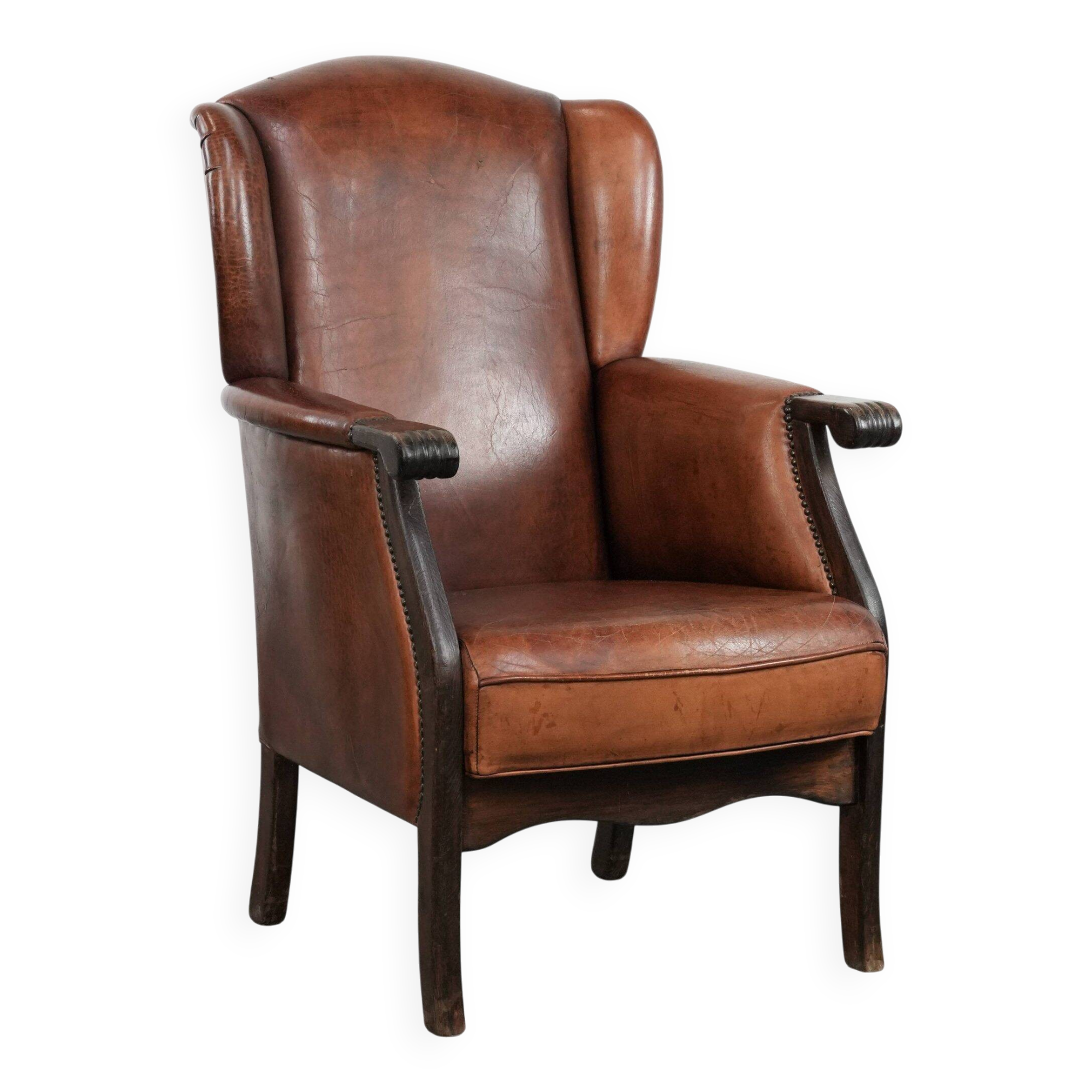 Classic vintage wingback chair in sheepskin and wood