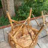 Round table with 2 rattan chairs