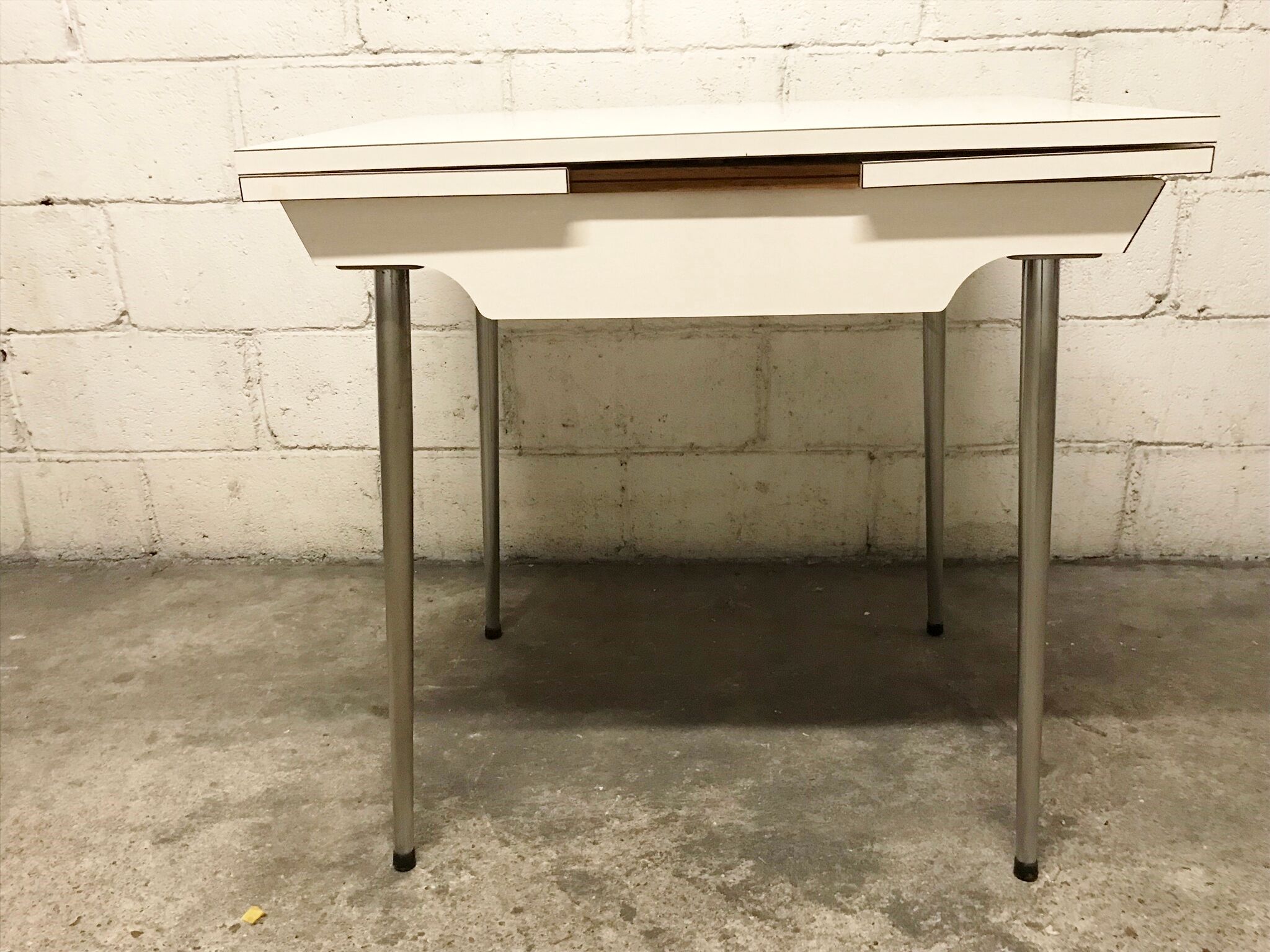 Off-white formica table / 70s cream with a tapered foot drawer