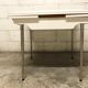 Off-white formica table / 70s cream with a tapered foot drawer