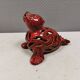 Beautiful seal in ceramic with metallic red glaze.