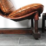 Brutalist oak lounge chair and ottoman, 1970s, set of 2