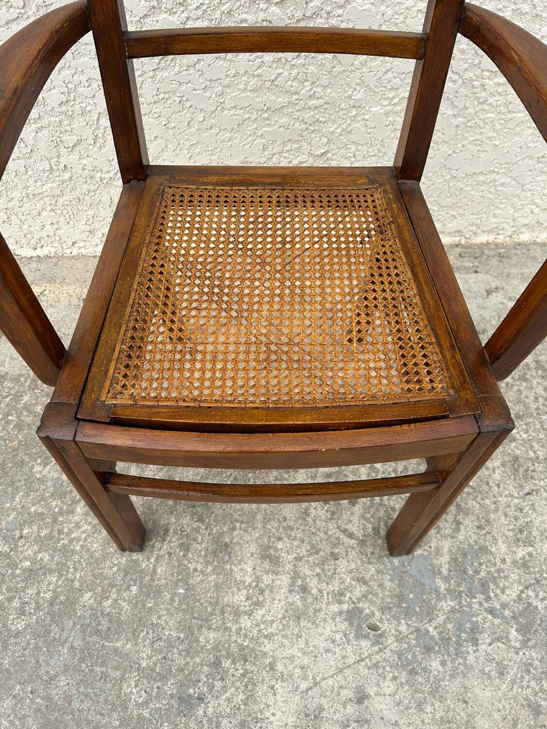 Cane armchair with armrests
