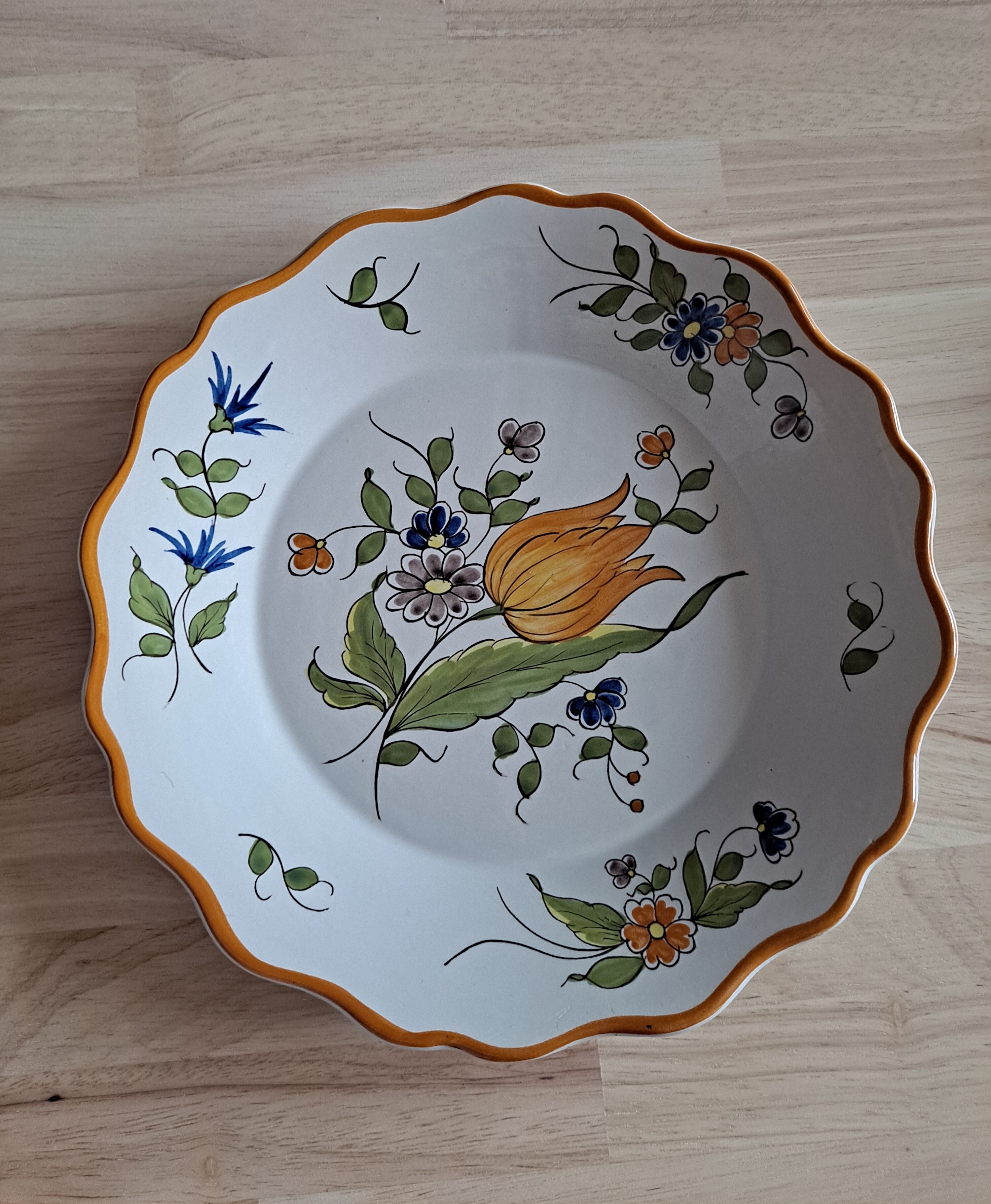 Glazed terracotta cap plate with yellow tulip