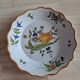 Glazed terracotta cap plate with yellow tulip