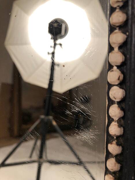 Napoleon III curved mirror, blackened wood frame with cream trim