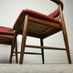 Pair of Scandinavian armchairs in teak and red faux leather – 1960s