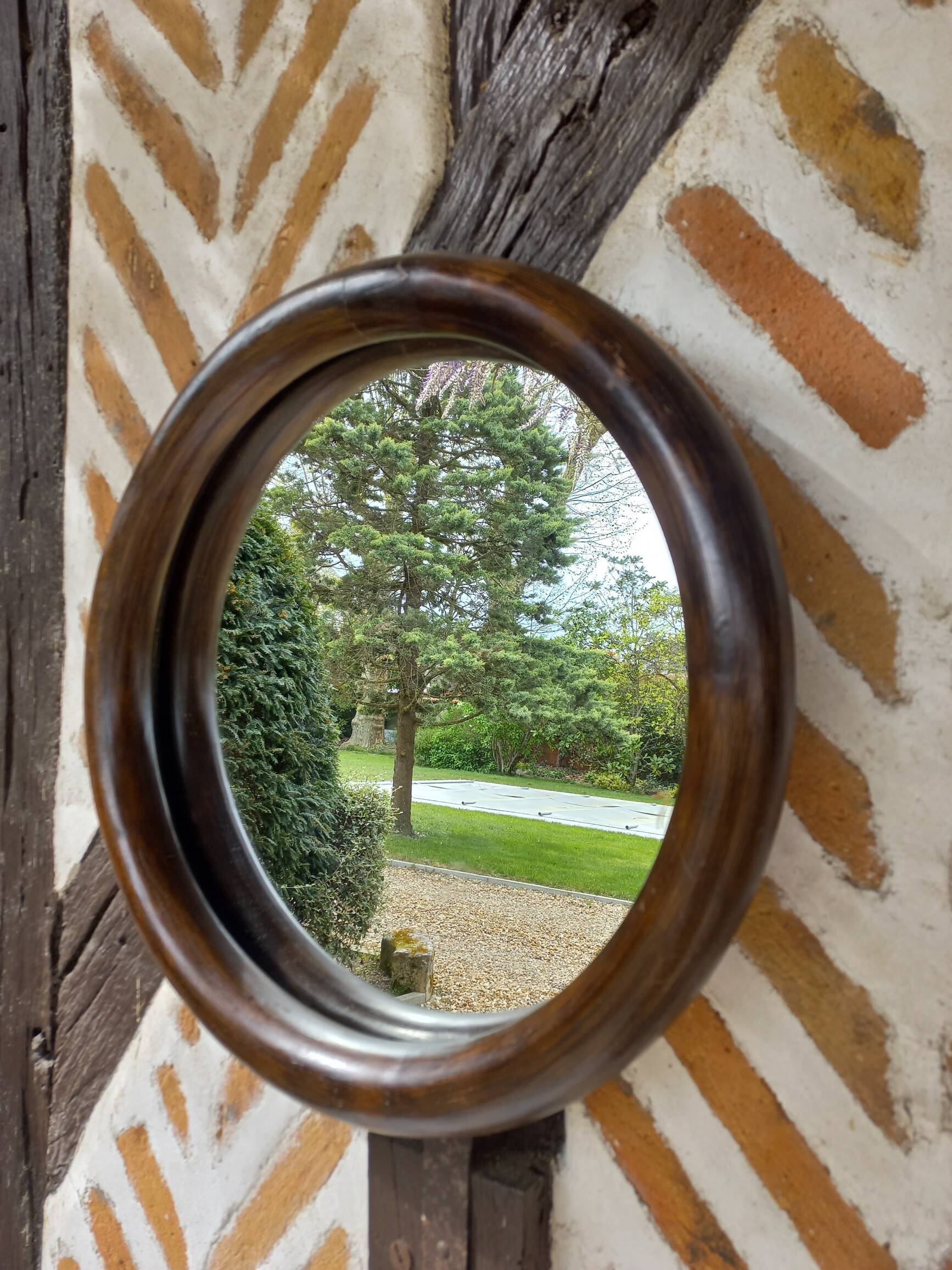 Vintage round bamboo mirror from the 1970s