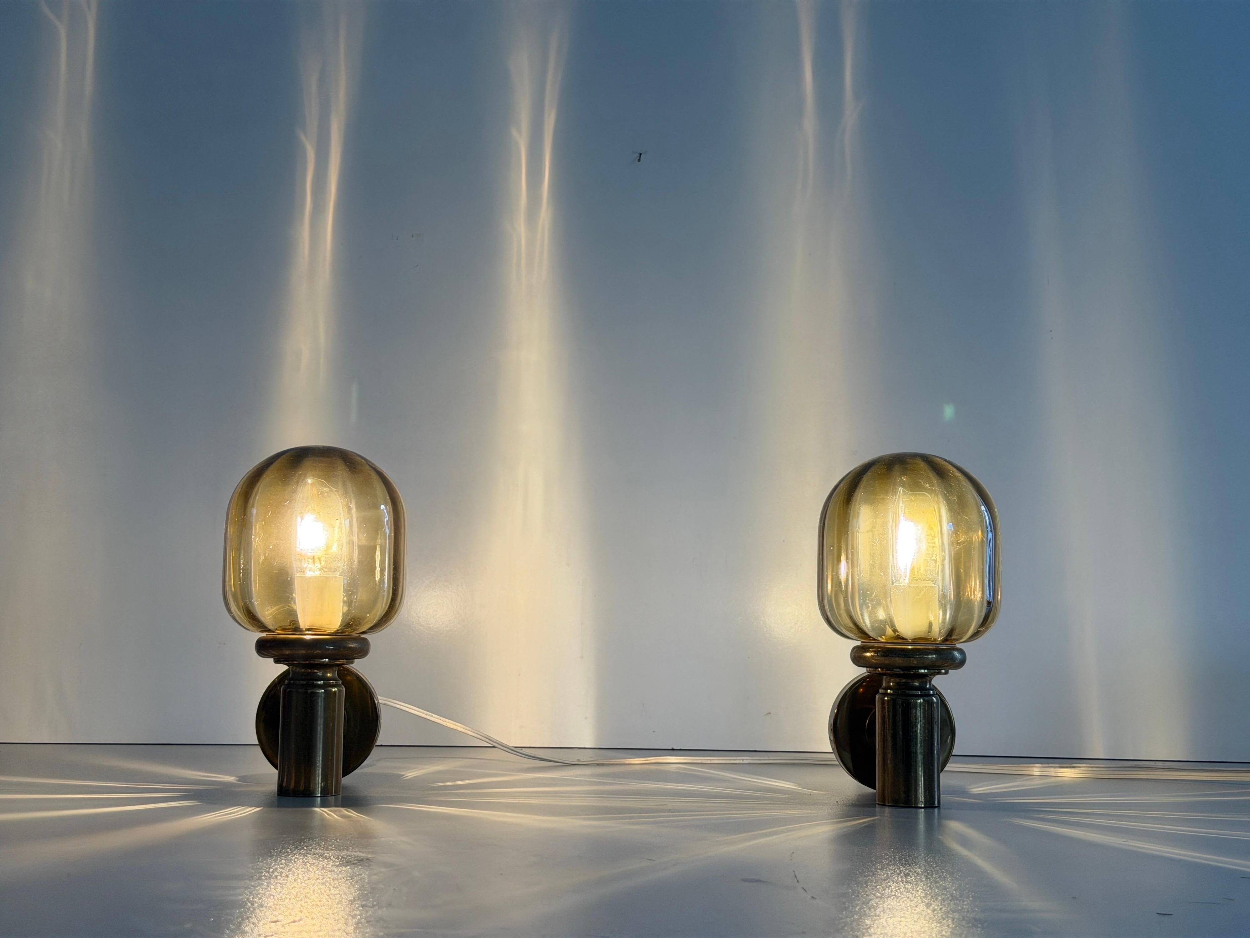 Pair of yellow glass and brass wall lights from the mid-century by N Leuchten, 1960s, Germany.