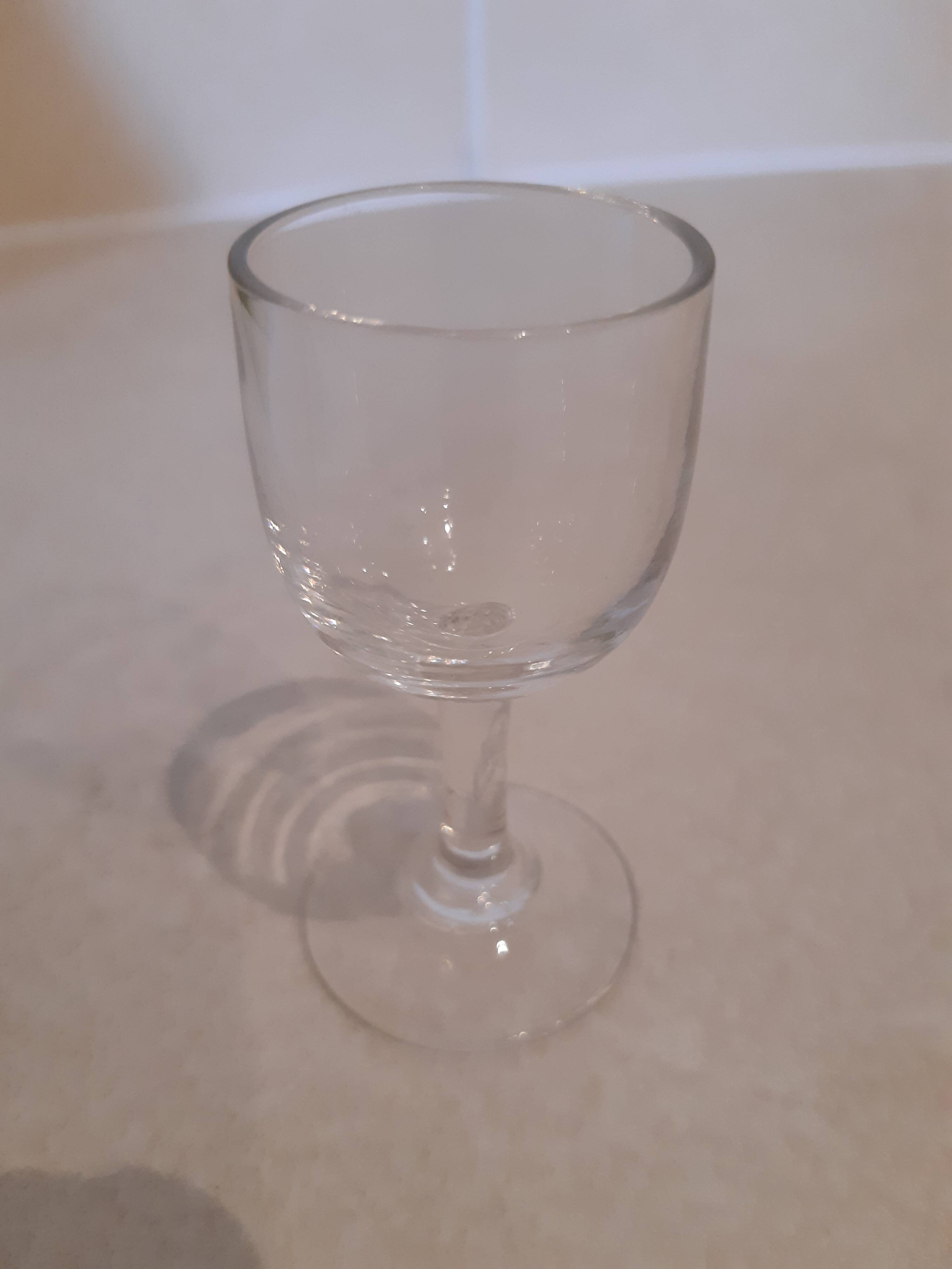 Set of 4 small stemmed glasses for strong alcohol.
