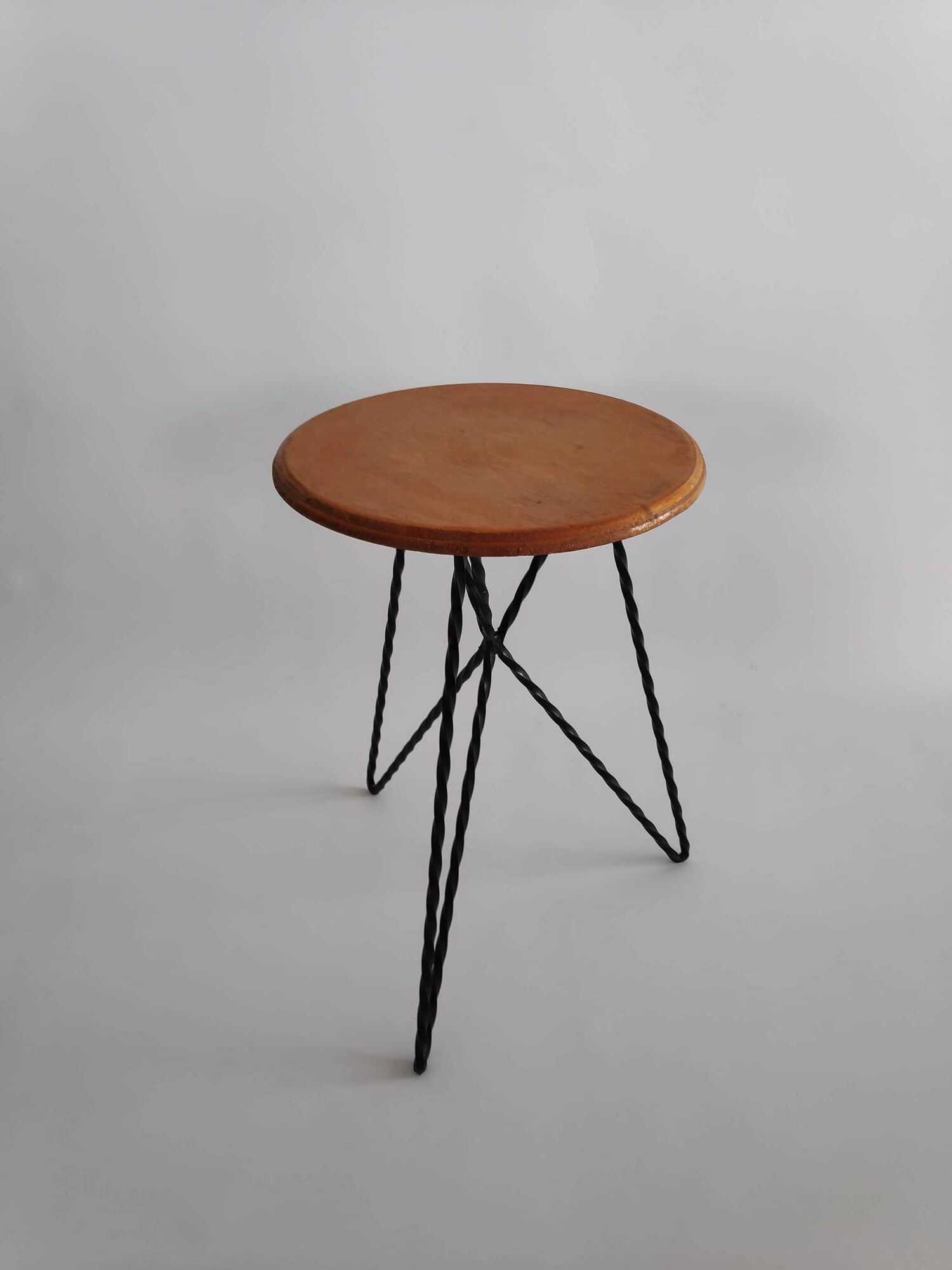 Vintage stool in wood and twisted metal of the years 60