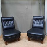 Pair of upholstered low chairs without arms