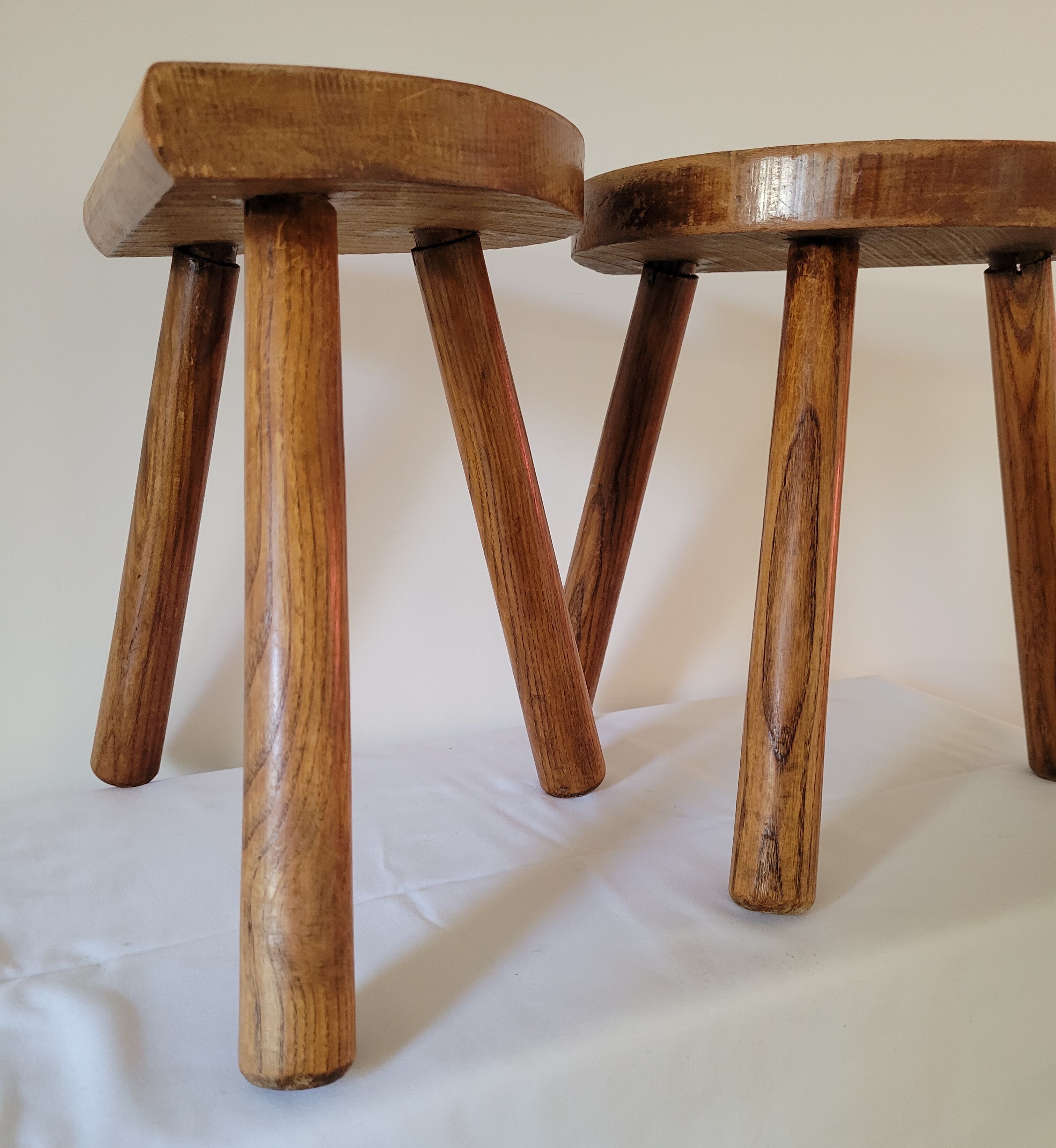 Pair of half-moon tripod stools