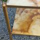 Pair of neoclassical side tables in bronze, brass, marble, and o.