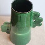 Handmade ceramic abstract vase with asymmetrical handles and fir green flowers