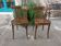 paire de chaises bistrot foncées, dossiers arrondis, style Baumann