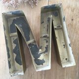 Golden vintage sign letter M