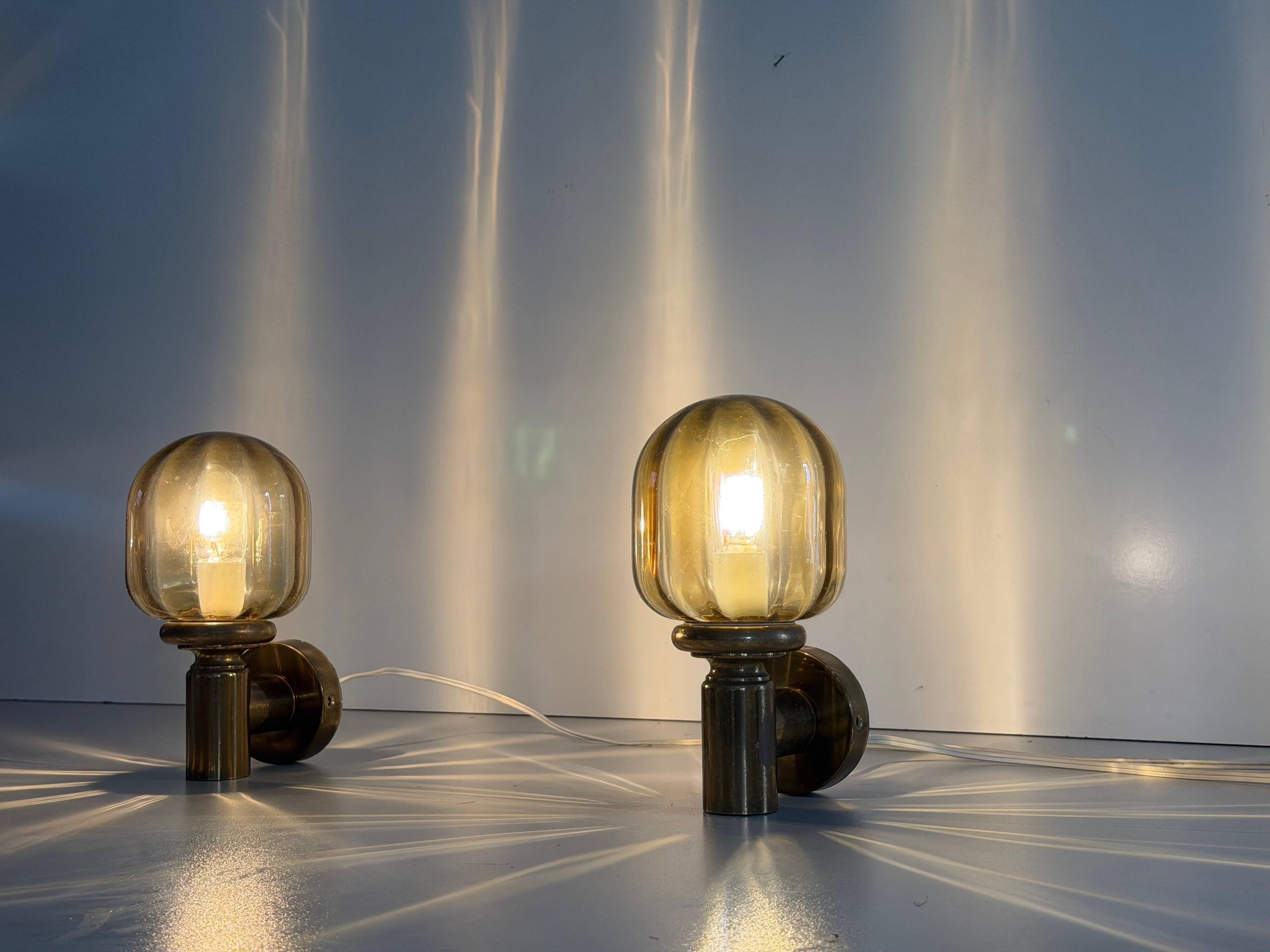 Pair of yellow glass and brass wall lights from the mid-century by N Leuchten, 1960s, Germany.