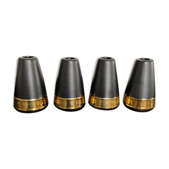 Series of 4 candle holders in black and gold ceramic