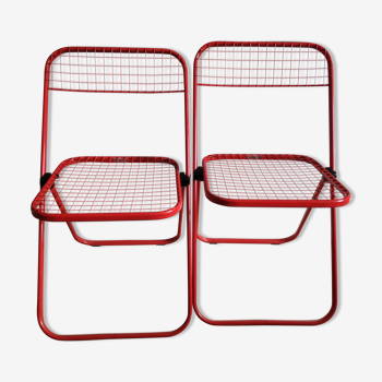 chaises pliantes rouges en métal crées par Talin en Italie