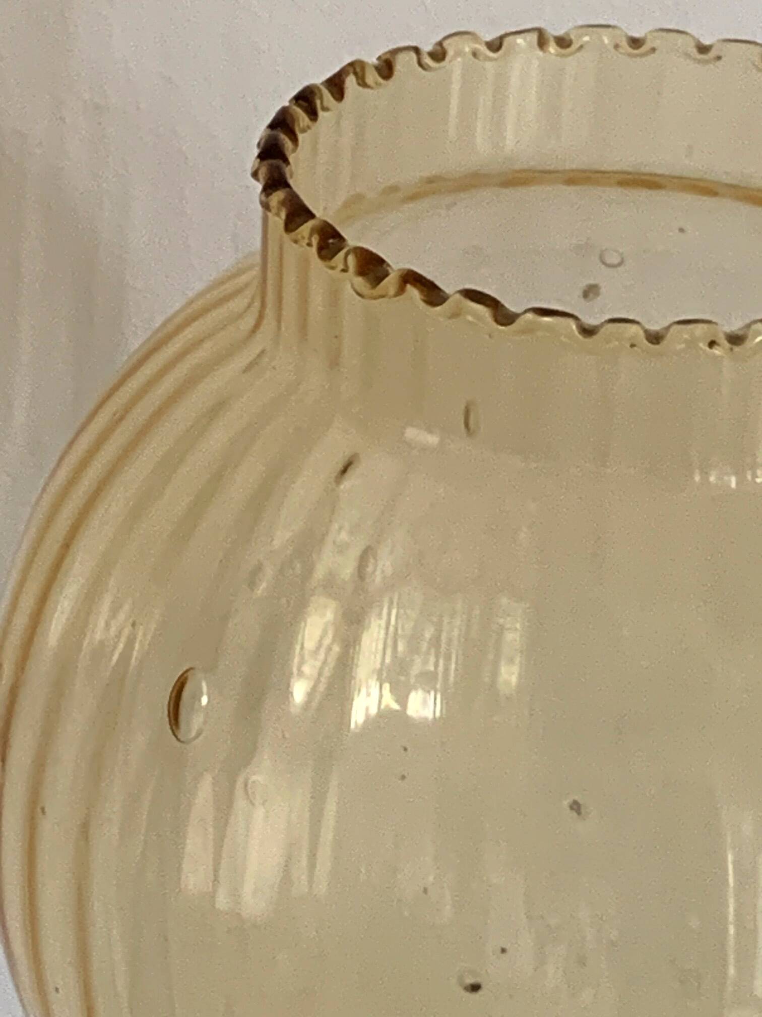 Table lamp with an antique gold glass lampshade