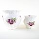 Pair of decorative ceramic vases with hand-painted roses, Art Deco style, European