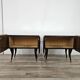 Mid-century mahogany bedside tables with mirrored tops.