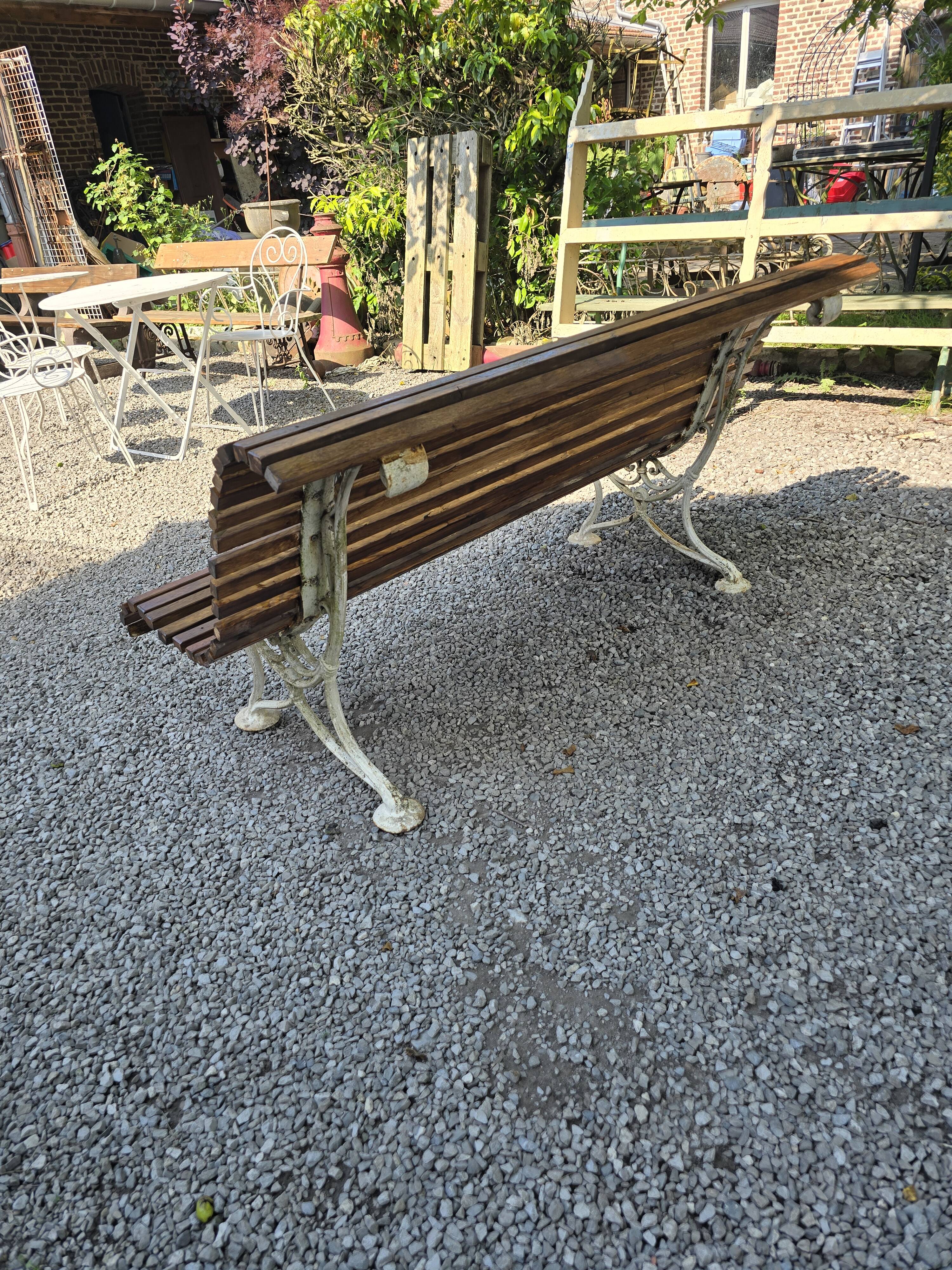 Garden bench with cast iron legs and oak slats